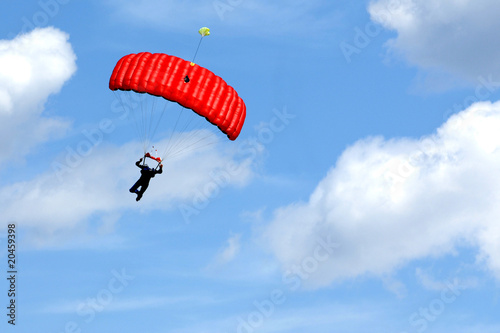 Extreme sports. parachuting under a blue sky photo
