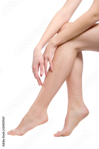 beautiful naked woman legs isolated on white