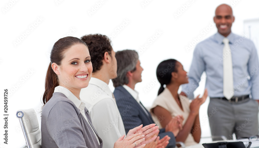 Positive business people clapping a good presentation Positive business people clapping a good presentation