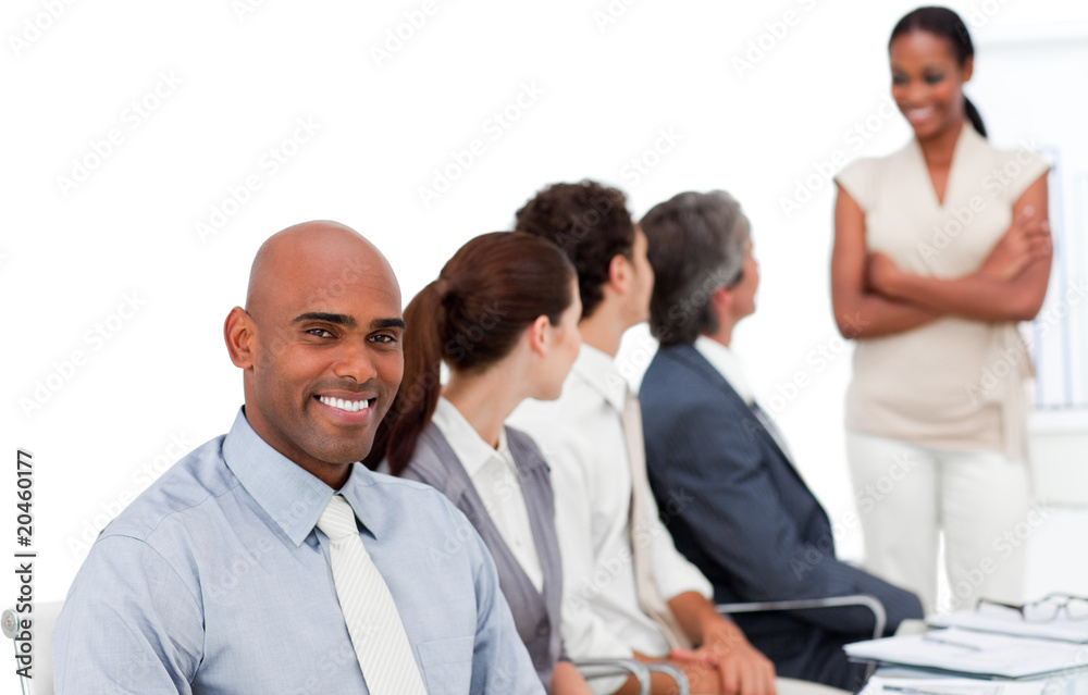 Multi-ethnic business group at a presentation Multi-ethnic business group at a presentation