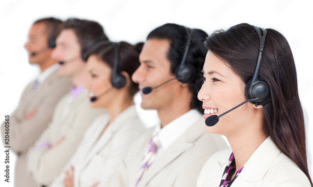 Positive business team with headset on standing in a row Positive business team with headset on standing in a row