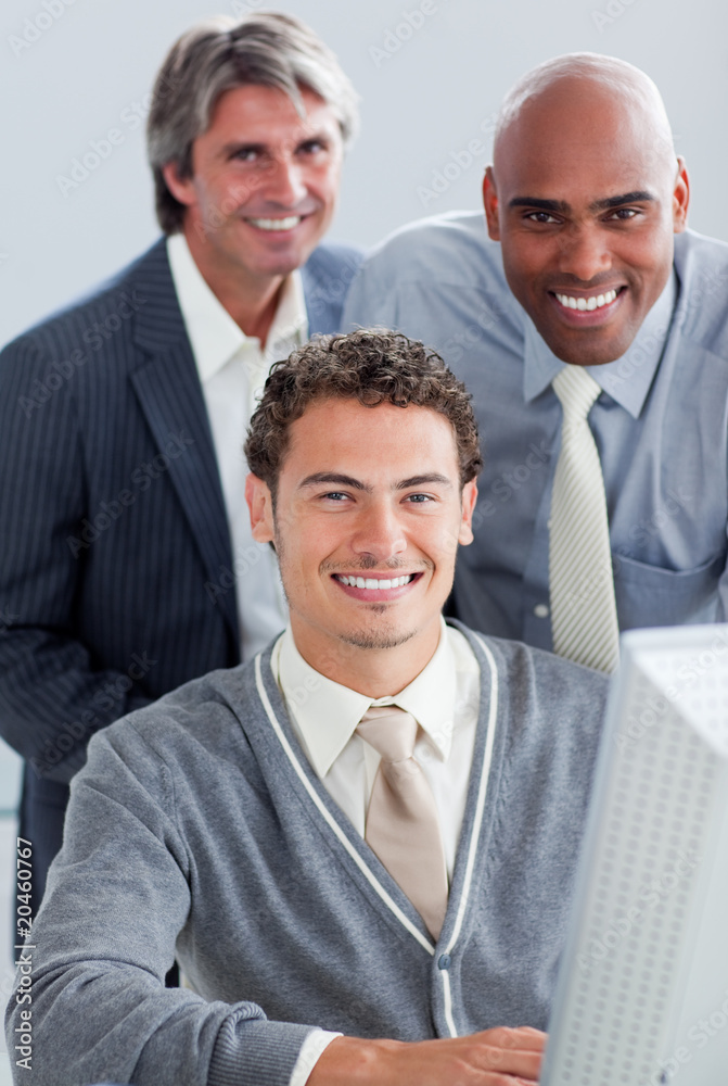 Charismatic business partners working at a computer Charismatic business partners working at a computer