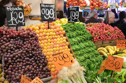 Fresh fruits on market stall together with prices