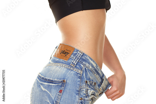 young woman is happy to lose weight photo