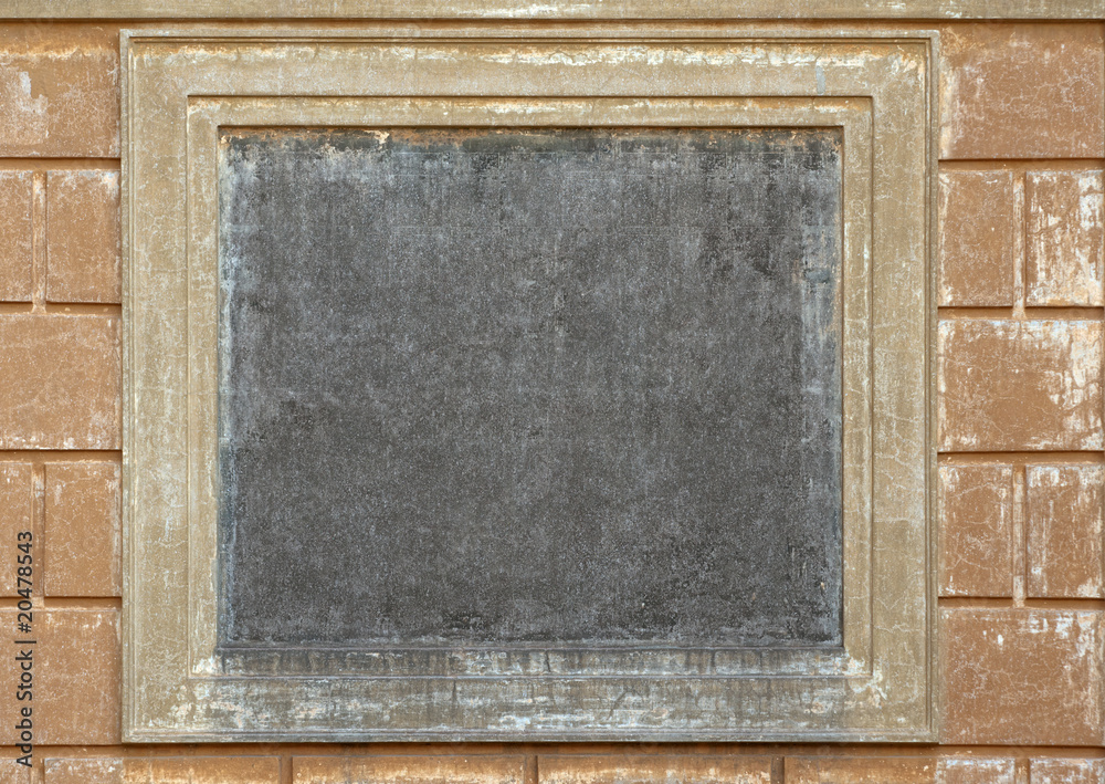 Naklejka premium Empty square medallion on ancient wall