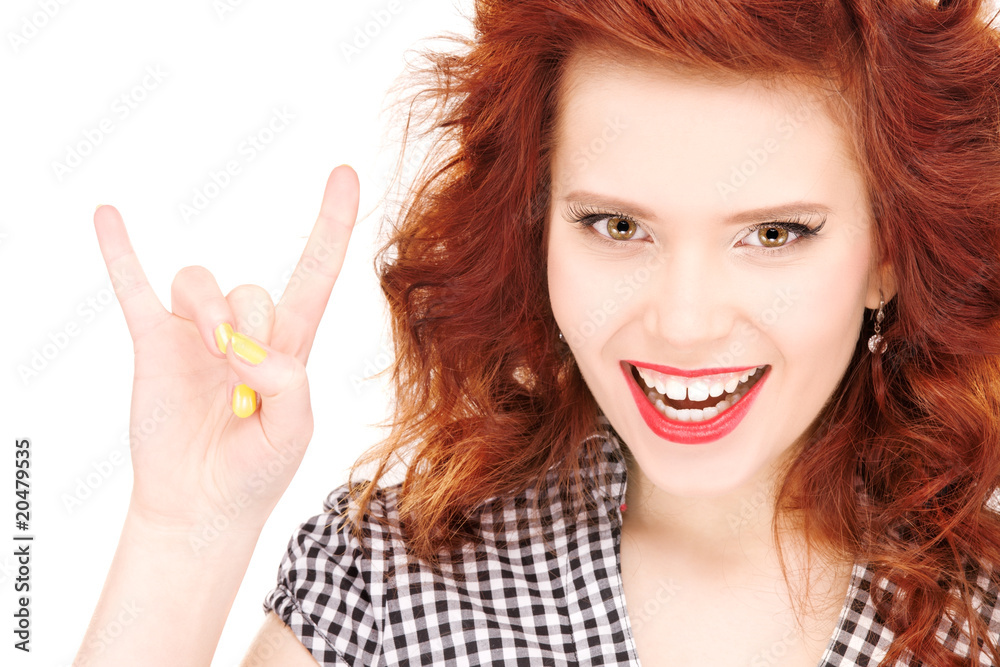 happy teenage girl showing devil horns gesture happy teenage girl showing devil horns gesture
