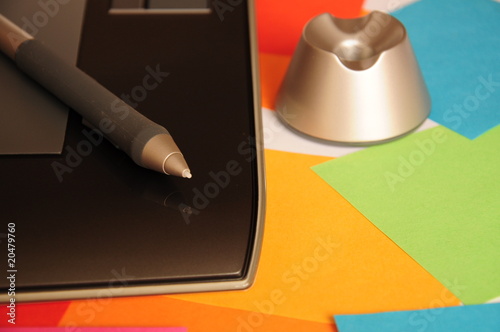 Electronic tablet, pen for drawing and pen holder.