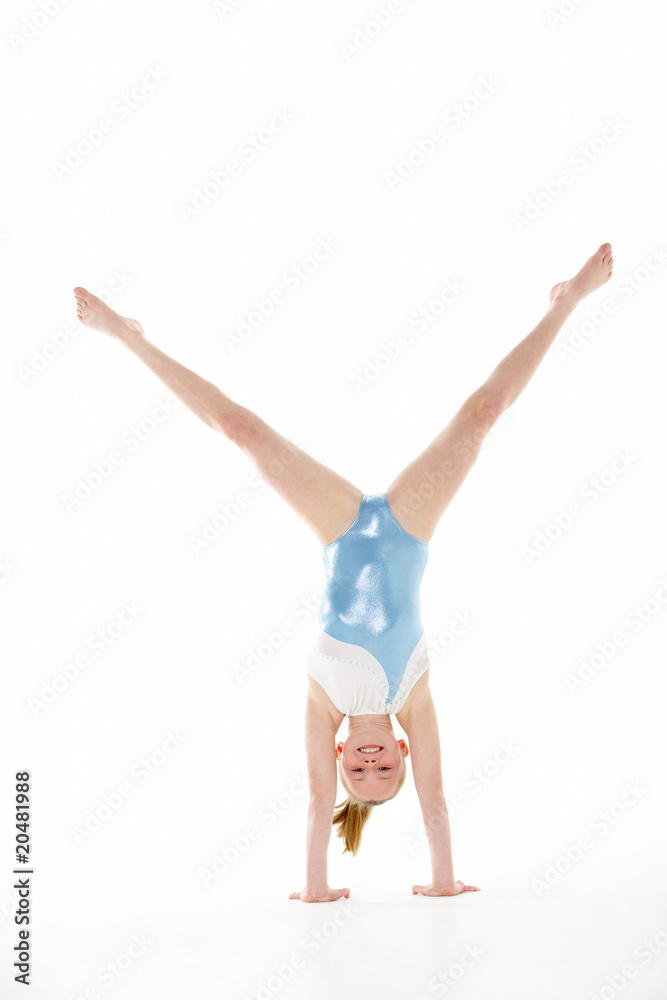 Fototapeta premium Studio Portrait Of Young Female Gymnast