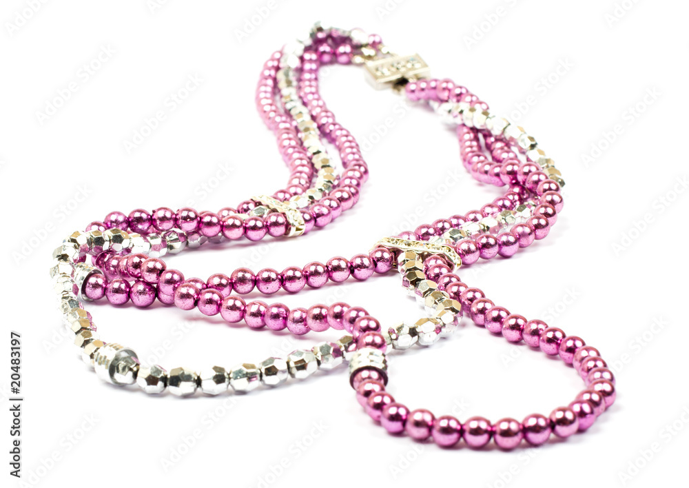 Pink plastic necklace on white background