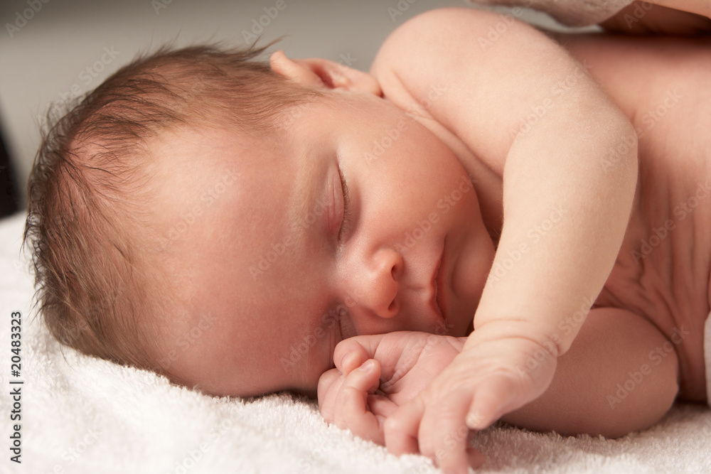 Close Up Of Baby Sleeping On Towel Close Up Of Baby Sleeping On Towel