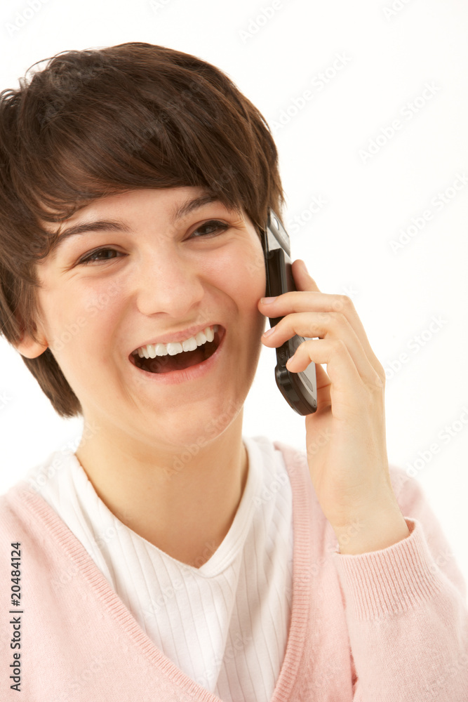 Studio Portrait Of Young Girl Using Mobile Phone Studio Portrait Of Young Girl Using Mobile Phone