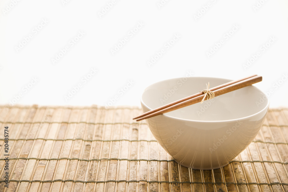 Chopsticks on an Empty Bowl. Isolated Chopsticks on an Empty Bowl. Isolated