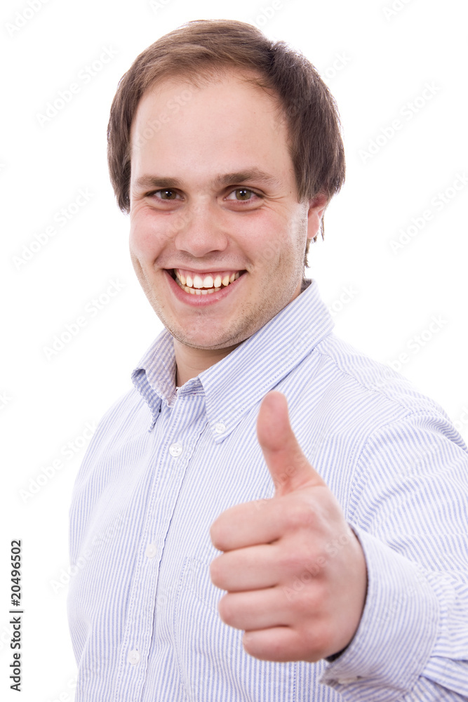 Portrait of a young man showing thumbs up sign against white bac Portrait of a young man showing thumbs up sign against white bac