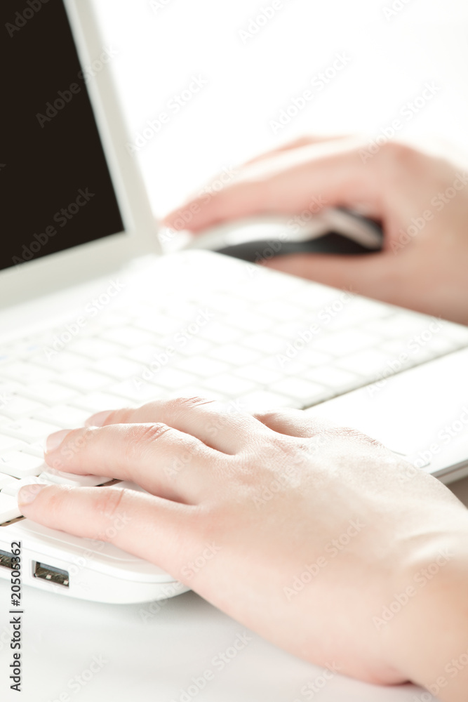 Female hands on a laptop keyboard Female hands on a laptop keyboard