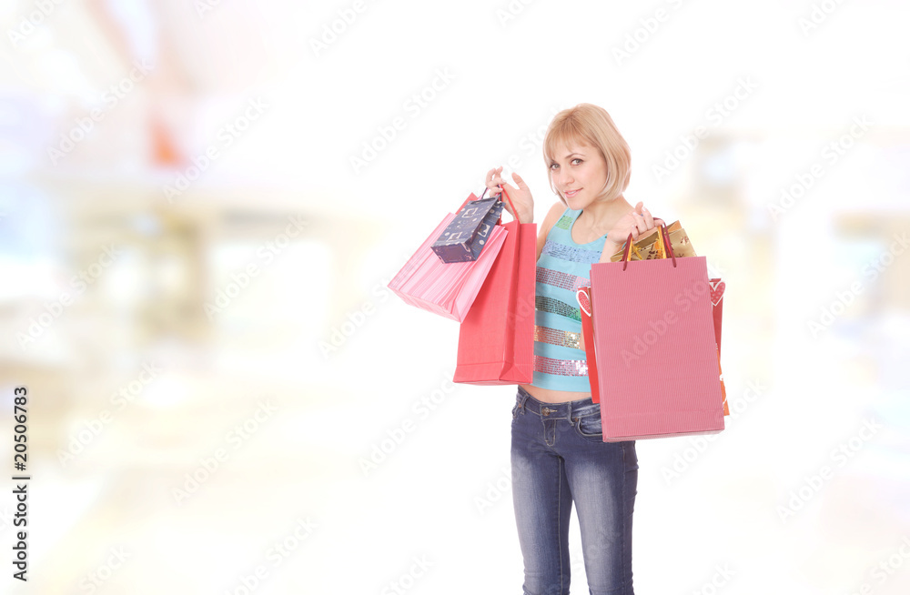 young woman smiling in the shopping mall. young woman smiling in the shopping mall.