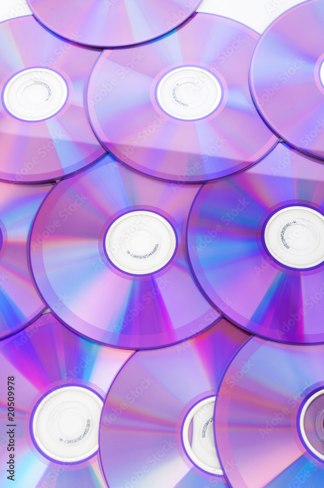 Many DVD's arranged at the white background Many DVD's arranged at the white background
