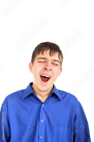 The yawning teenager isolated on the white