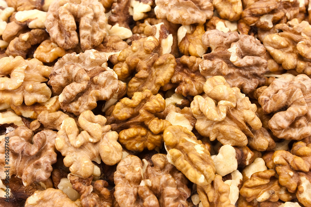 Brown raw walnuts textured background Brown raw walnuts textured background