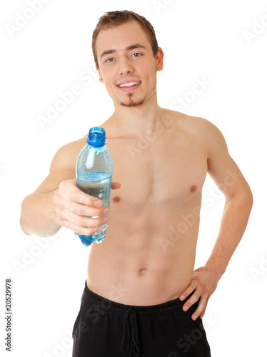 young sportsman with a bottle of clear liquid