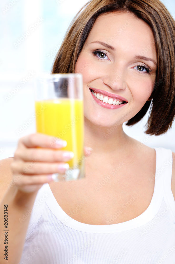 Attractiv happy Woman with glass of orange juice Attractiv happy Woman with glass of orange juice