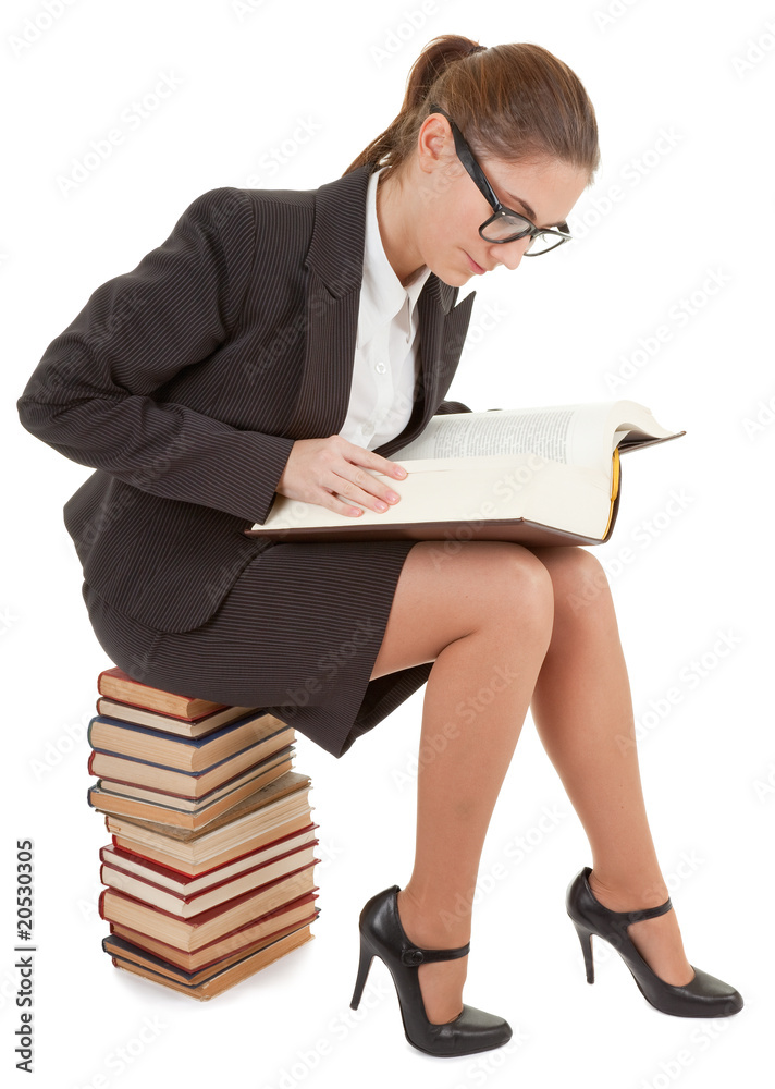 woman and a pile of books