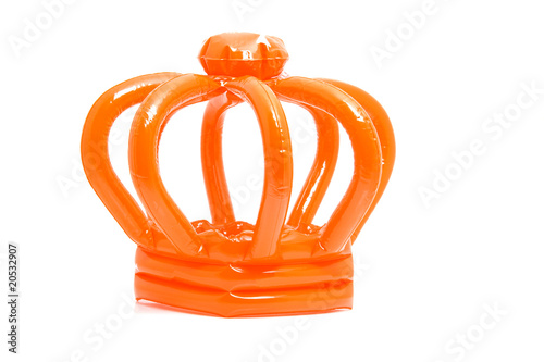 Orange blown up crown over white background