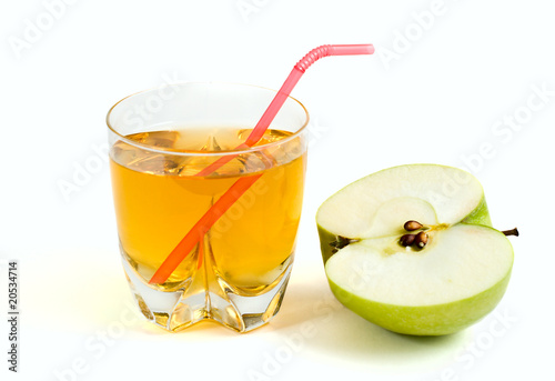 half a green apple and a glass of apple juice