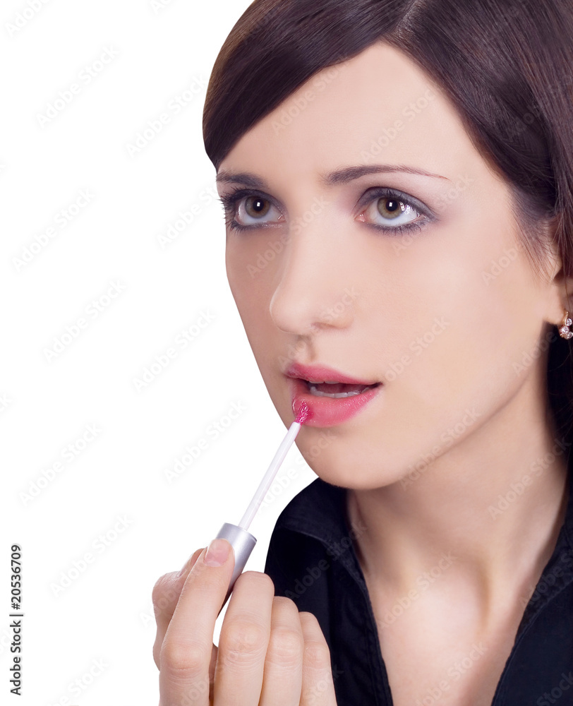 picture of beautiful woman applying lipstick using lips brush picture of beautiful woman applying lipstick using lips brush