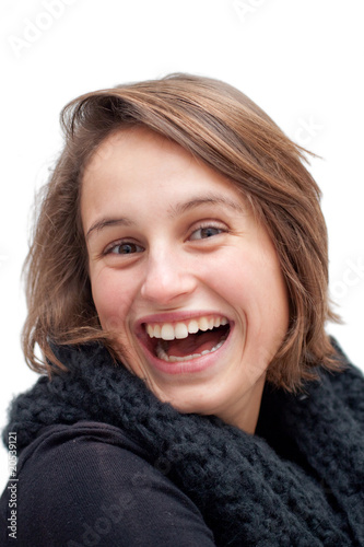 Portrait of a joyful young woman laughing