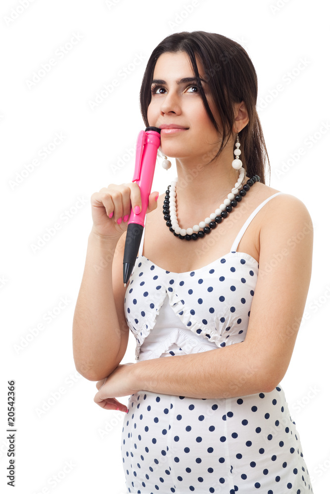 Beautiful young woman thinking holding big pink pen Beautiful young woman thinking holding big pink pen