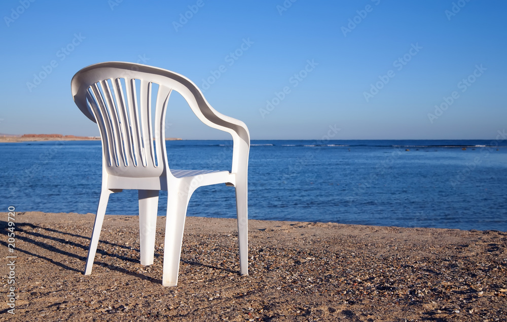 White chair at sand beach