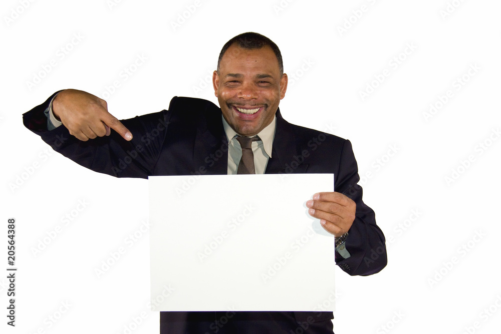 smiling African-American businessman pointing at white board smiling African-American businessman pointing at white board