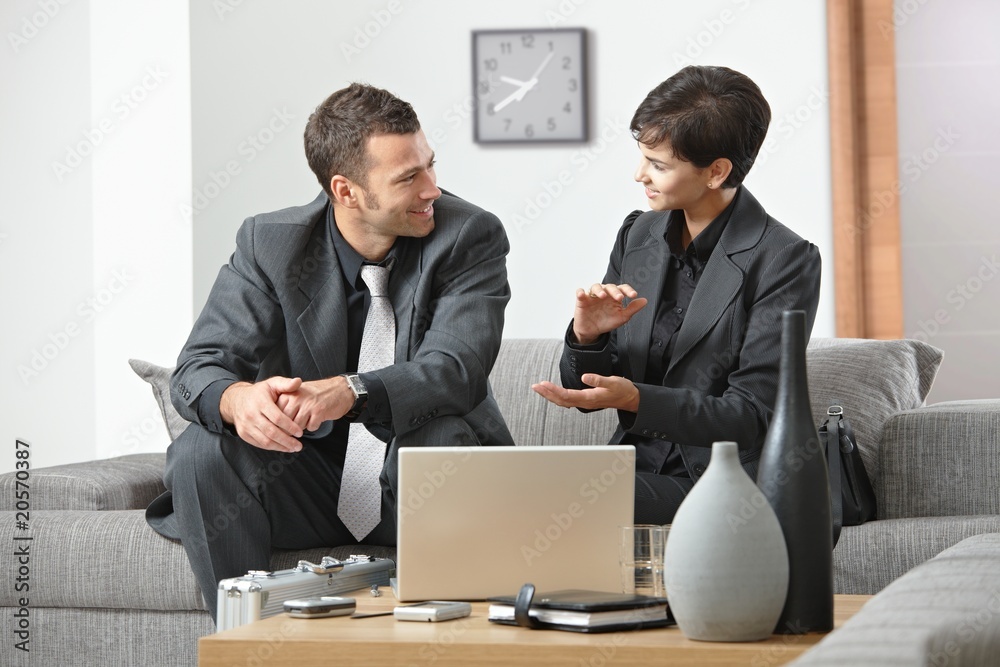 Businesswoman explaning to businessman Businesswoman explaning to businessman