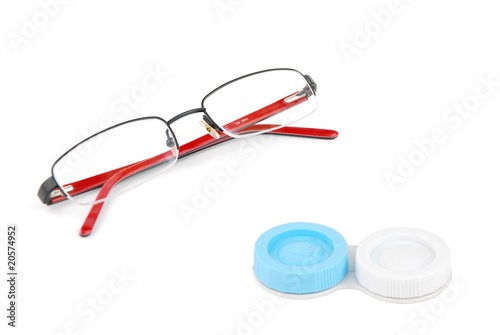 Glasses and contact lenses case on white
