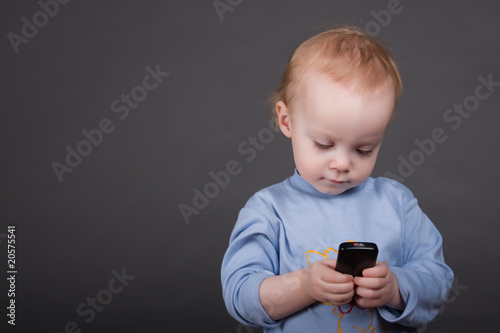 child speaks on his cell phone