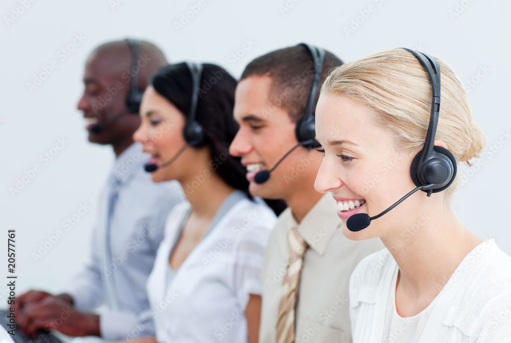 Portrait of smiling business people working in a call center Portrait of smiling business people working in a call center