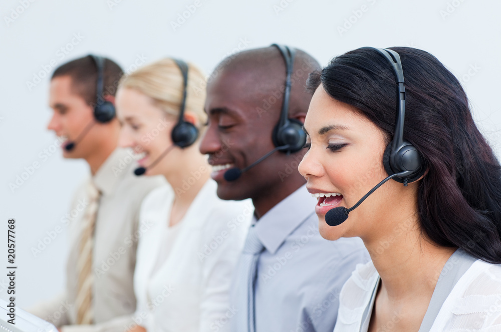 Multi-cultural business people working in a call center Multi-cultural business people working in a call center
