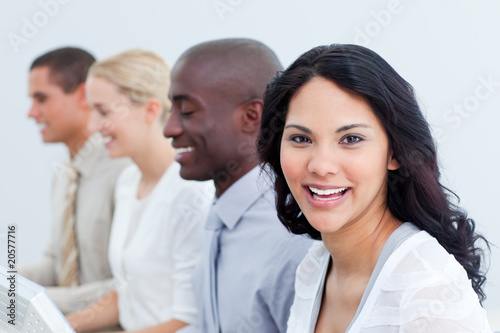 Brunette businesswoman and her team at work