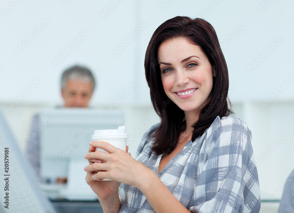 Glowing businesswoman drinking a coffee Glowing businesswoman drinking a coffee