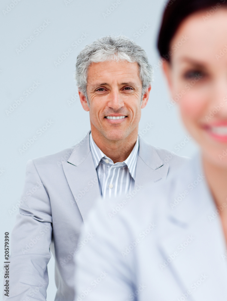 Mature businessman smiling at the camera Mature businessman smiling at the camera