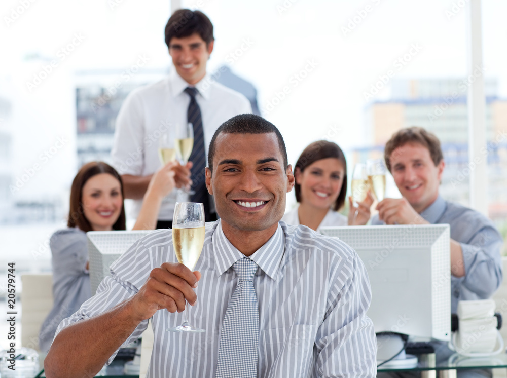 Lucky business team drinking champagne Lucky business team drinking champagne