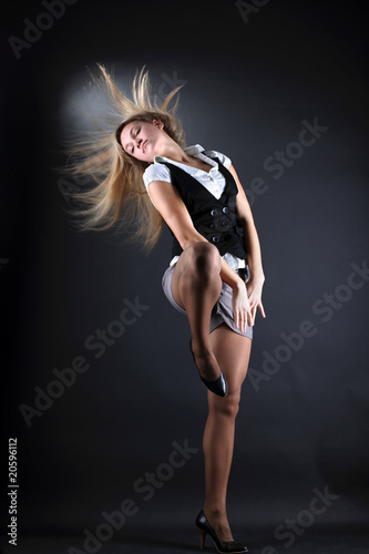 woman modern dancer against black background