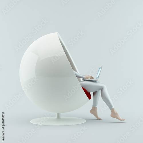 The girl sitting in a chair with a laptop on his lap.