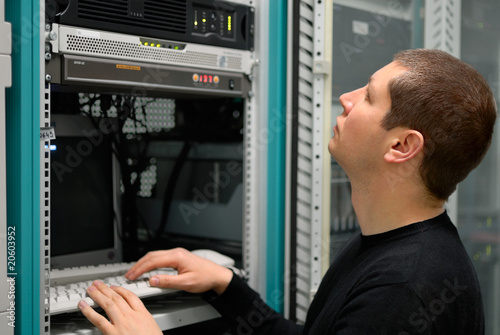 Network technician perform preventive maintenance to a server