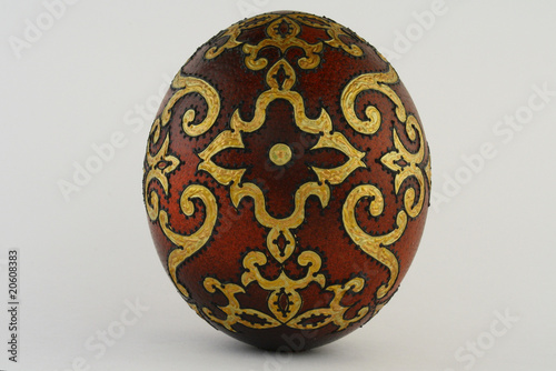Painted Easter egg with decorative ornament