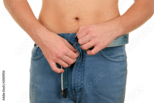 Teenager clasps fly on trousers