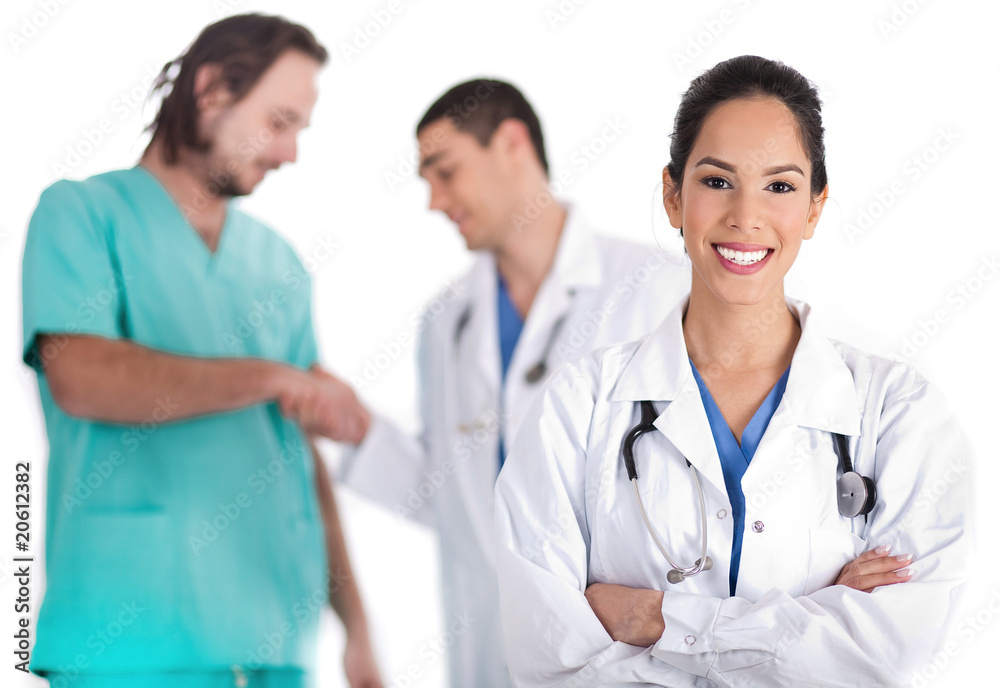 young doctor smiling, other doctor giving shakehand to nurse young doctor smiling, other doctor giving shakehand to nurse