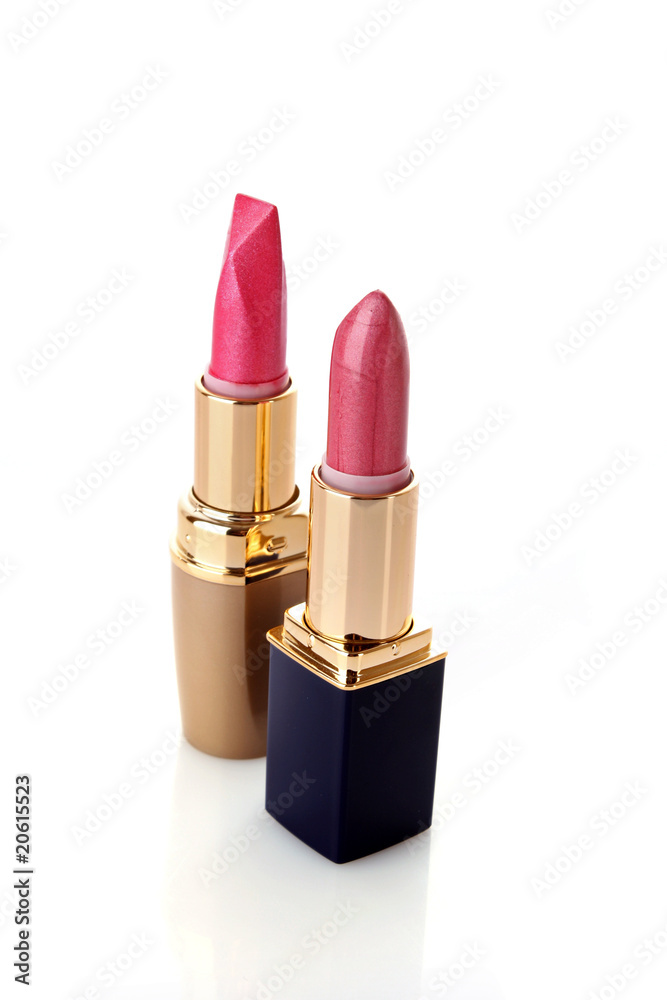 Fototapeta premium Two new lipsticks on the white background