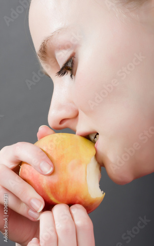 young girl is bitten apple