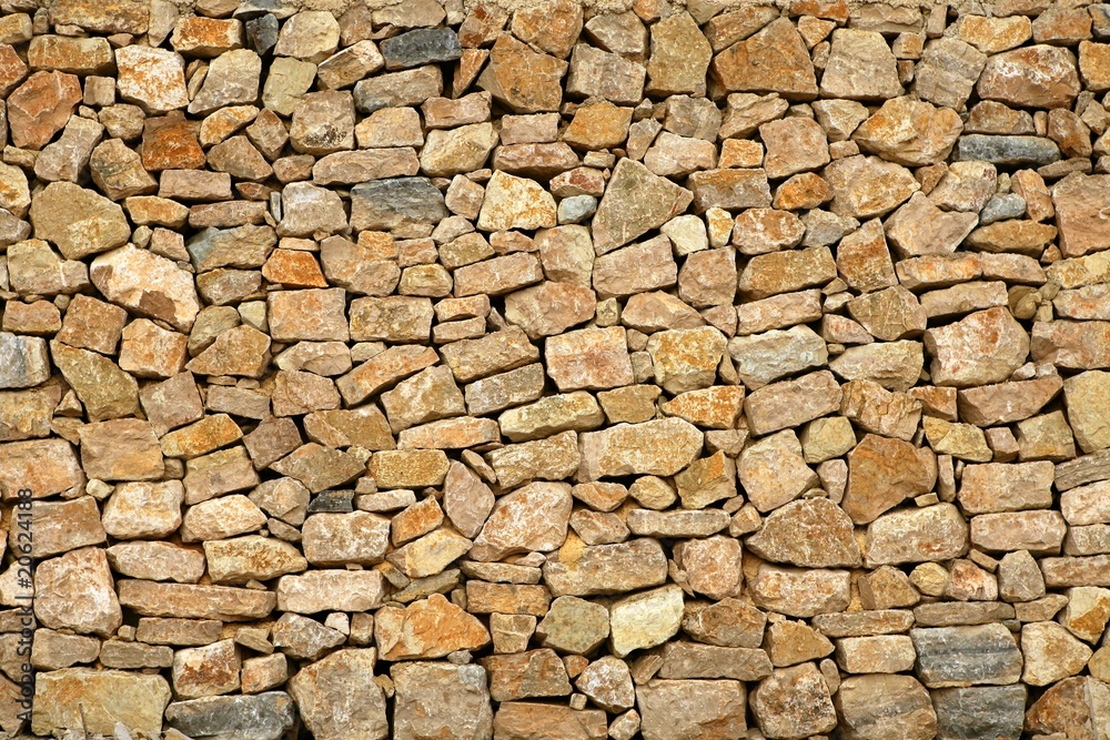 Golden masonry stone wall from old building Golden masonry stone wall from old building